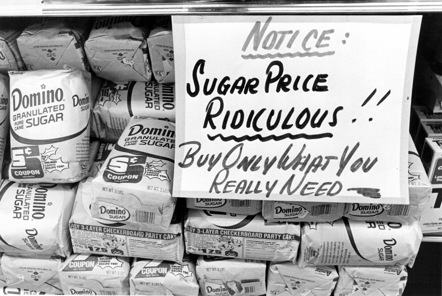 Black and white photo of sugar sale